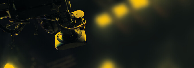 TV Camera broadcast on the crane tripod for shooting or recording and broadcasting content in studio production to on air tv or online internet live show. HD Video recording on crane. Selective focus.