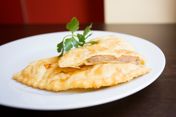 A blini, or sometimes blin, is a Russian and more broadly Eastern European pancake that is traditionally made from buckwheat or wheat flour today and served with smetana, tvorog, butter, caviar, ...