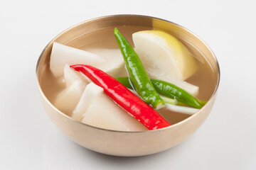 One of the radish kimchi. It is often soaked in winter, and boiled pickled radish is poured into...