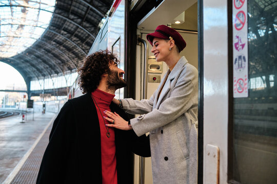 Couple saying goodbye in a train station
