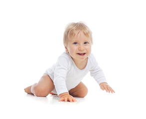Little, happy and smiling cute baby in the studio. Portrait of a one year old baby. The concept of happiness.