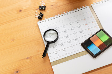 Planner Calendar and agenda reminders, work from home.  for plan daily meeting and note holiday trip in diary at office desk. 2023 calendar reminder concept.