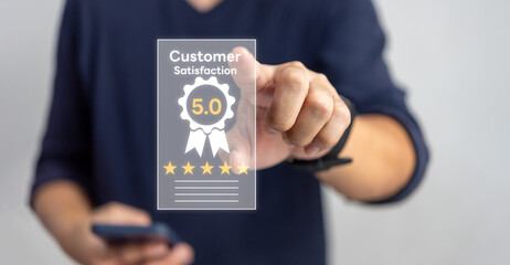 Customer service satisfaction evaluation concept. Man using smartphone and touching on screen with gold five star rating excellent feedback icon, Rated a very good review.