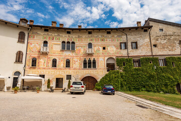 Ancient Spilimbergo castle in Gothic-Renaissance style, medieval origins - XV century, main facade with numerous frescoes. Pordenone province, Friuli-Venezia Giulia, Italy, Europe.