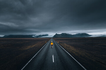A road with a mysterious landscape on the background
