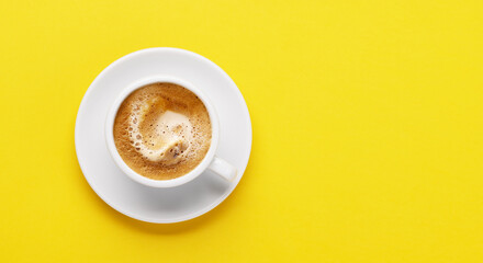 Obraz na płótnie Canvas Espresso coffee on yellow background