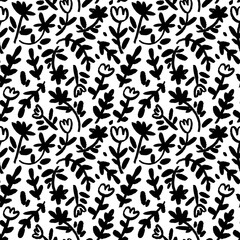 Childish floral pattern in small black flowers on stems. Ditsy print, spring botanical seamless pattern. Brush drawn vector wild flowers. Hand drawn sketch chamomiles and branches with leaves.