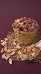 Close up of Salted Peanuts Indian namkeen (snacks) on a ceramic white bowl. Top view