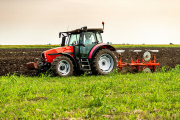 Scientific land preparation with tractor plowing and cultivating of stubble field for crops