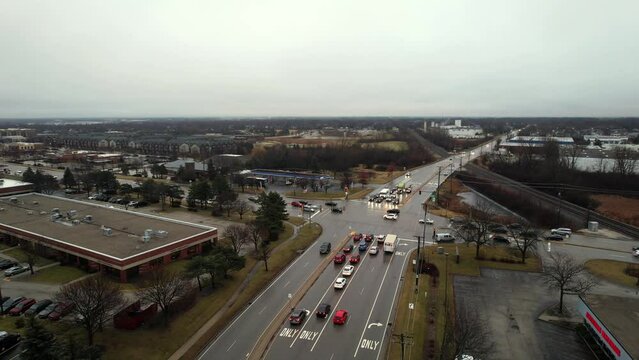 Vernon Hills, Illinois intersection Townline rd with butterfield rd at sunset rush hour on rainy day aerial 4k