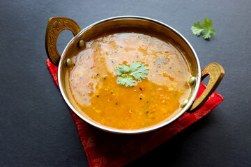 Healthy nutritious Indian comfort food Dal Chawal. Popular food yellow Dal Tadka or lentil curry. Protein rich superfood. copy space.