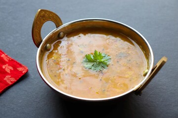 Healthy nutritious Indian comfort food Dal Chawal. Popular food yellow Dal Tadka or lentil curry. Protein rich superfood. copy space.