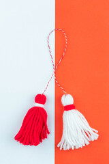 Traditional Martisor - symbol of holiday 1 March, Martenitsa, Baba Marta, beginning of spring and seasons changing in Romania, Bulgaria, Moldova. Greeting and post card for holidays.