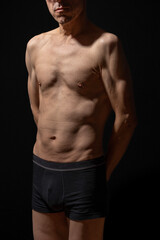 Fototapeta premium Paris, France - 01 09 2023: still life. Studio shot of a mature man posing shirtless