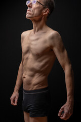 Fototapeta na wymiar Paris, France - 01 09 2023: still life. Studio shot of a mature man posing shirtless