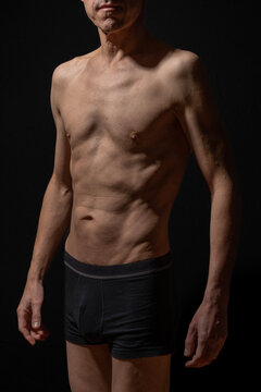 Paris, France - 01 09 2023: still life. Studio shot of a mature man posing shirtless