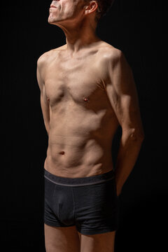 Paris, France - 01 09 2023: still life. Studio shot of a mature man posing shirtless