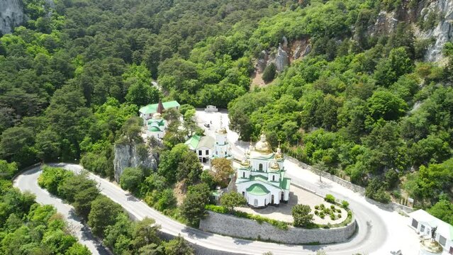 Christian church in the mountains above the sea. Temple of the Holy Archangel Michael in Oreanda. The southern coast of Crimea. Aerial view