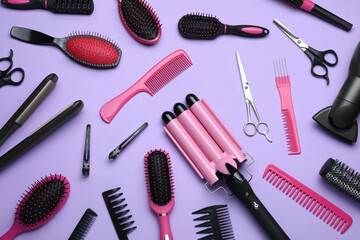 Flat lay composition of different professional hairdresser tools on lilac background