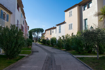 Fototapeta na wymiar Port Grimaud streets with houses and plants
