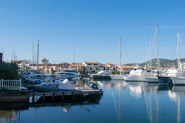 Fototapeta premium Port grimaud hotels boats and river with palm tree
