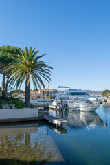 Fototapeta premium Port grimaud hotels boats and river with palm tree