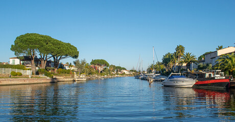 Fototapeta premium Port Grimaud house on river shore with yachts