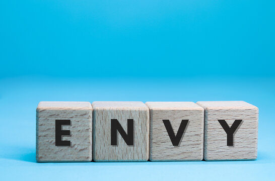envy word on cube blocks