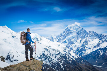 Fototapeta na wymiar Hiker with backpack on the mountain top. Sport and active life concept