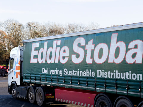 Strensham, England - December 2022: Side view of an articulated lorry operating by the Eddie Stobart trucking company