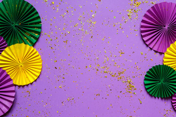 Mardi gras.Holidays mardi gras masquarade, venetian mask  fan over purple background. view  above,mardi gras background copy space Happy Mardi Gras . Fat Tuesday carnival texture golden,green purple