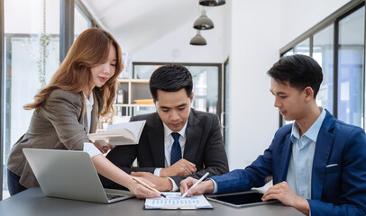 Business team present. professional investor working new start up project. Finance managers meeting.using smart phone and laptop and digital tablet computer in modern office.