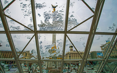 view of the statue of independence of Ukraine in the snow from a glass dome. Ukraine