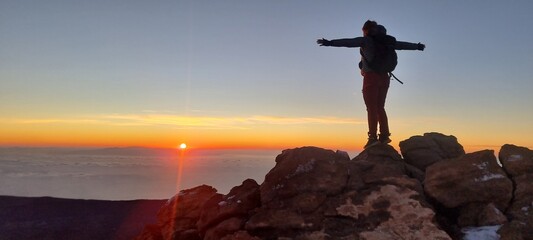 Girl on the summit of El Teide vulcano at sunrise, Tenerife, Spain © Mira