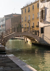 Fototapeta na wymiar Closeup detail of a beautiful old bridge in Venice, Italy