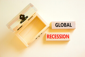 Global recession symbol. Concept words Global recession on wooden blocks. Beautiful white table white background. Wooden empthy chest. Business and global recession concept. Copy space.