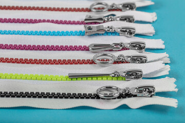 Multicolored Zippers or Zip Fasteners used for binding fabric or textile. Colorful Clasp Lockers...