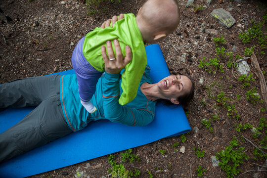A woman plays with her baby daughter at their campsite by Ypsilon Lake, Rocky Mountain National Park, Colorado.