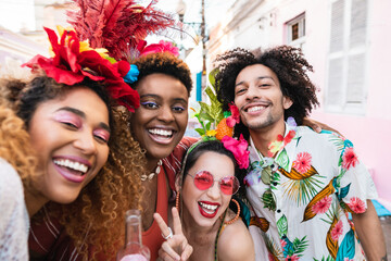 Carnival in Brazil at street party, friends in costume have fun and take selfie.