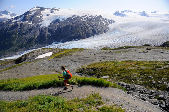 Backpacker hikes the Harding Icefield Trail in Kenai Fjords National Park near Seward, Alaska.