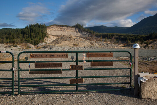 Signs pay tribute to the dead at the site of the 22 March 2014 mudslide in Oso, Washington.