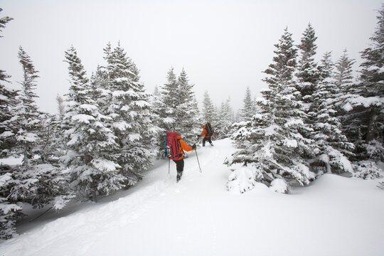 Two men hiking through the snow on Mt. Washington.