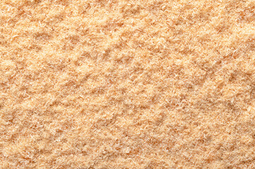 Wood flour, wood powder, fine sawdust, close-up, surface from above. Formed by sawing dried spruce....