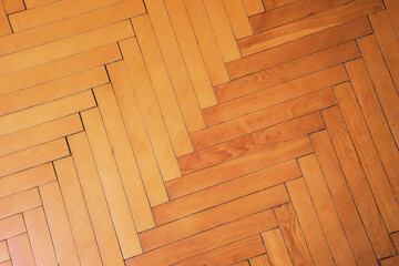 Brown and yellow wooden vintage parquet herringbone pattern.