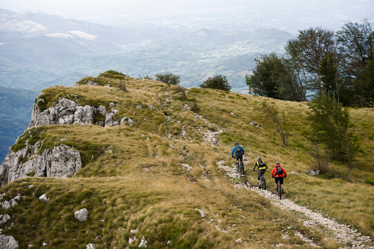 three mountain bikers on the way, Vipava valley, Istria, Nanos, Slovenia
