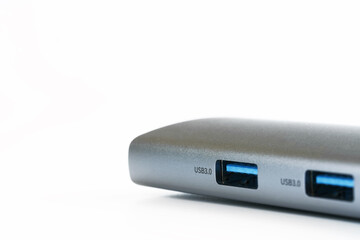 Modern usb 3.0 type-a connectors on the body of a portable gadget - a hub. White background. Selective focus. Copy space. Macro