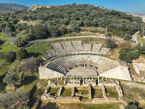 Torbali, Izmir, Turkey: View of the reconstructed theater in the ancient site of Metropolis in Izmir, Turkey, with the village of Yenik&ouml;y in the background.