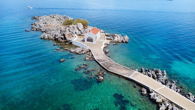 Authentic traditional Greek islands- unspoiled Chios, little church in the sea over the rocks Agios Isidoros. Eastern Aegean islands