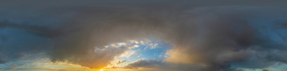 Dramatic sunset sky panorama with Cumulus clouds. Seamless hdr 360 pano in spherical...