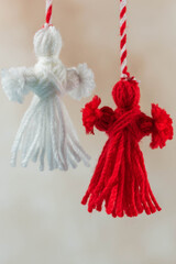 Traditional Martisor - symbol of holiday 1 March, Martenitsa, Baba Marta, beginning of spring and seasons changing in Romania, Bulgaria, Moldova. Greeting and post card for holidays.